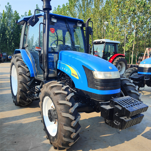 Used New Holland 1004 tractor with front ballast and dry land tyres used New Holland 1004 tractor front ballast and dry land tyres